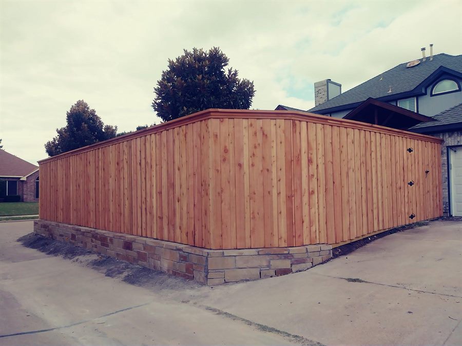 Wood fence with rails and a capboard